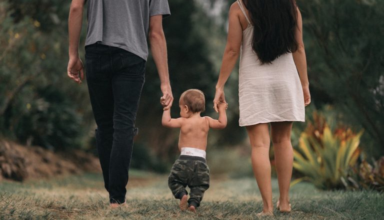 family walking young child